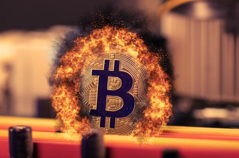 Bitcoin cryptocurrency burning in fire